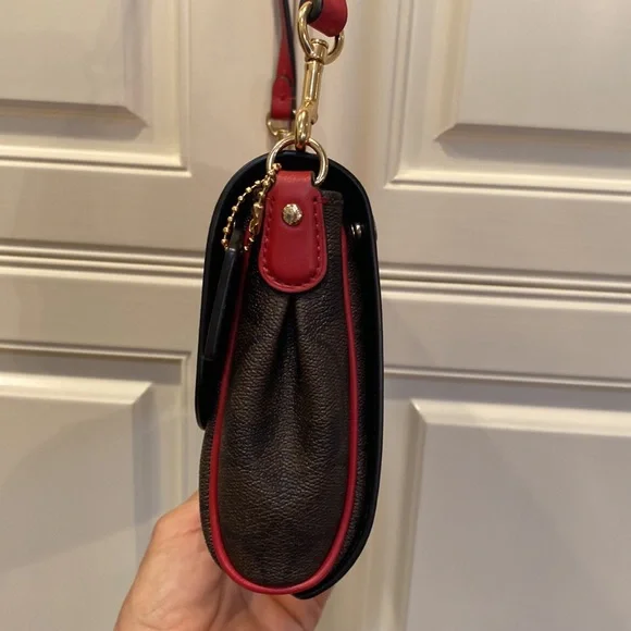 This is a like new coach cross body bag. - Picture 7 of 9